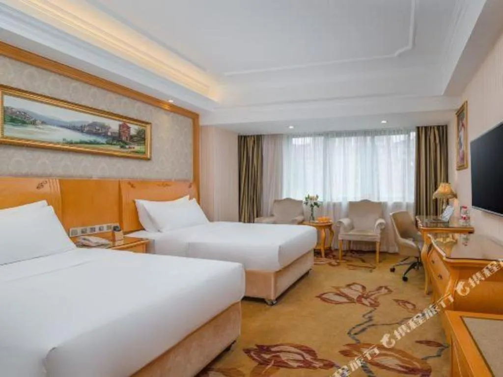 Bed in Vienna Hotel Chengdu Airport Shuangliu Wanda