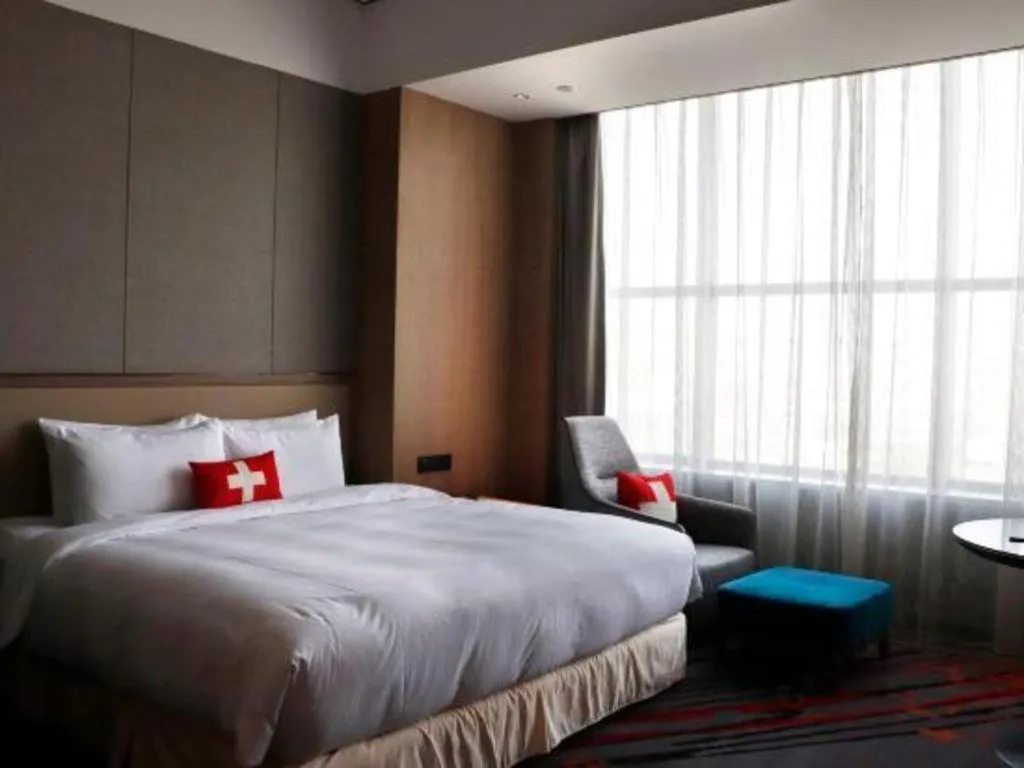 Bed in Swisstouches Hotel Ankang