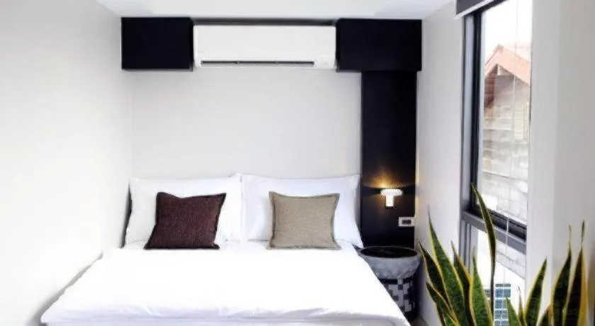 Bed in The River House Chiangkhan Hotel