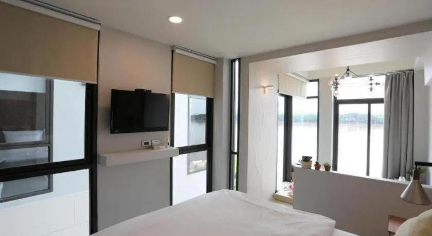 Bed in The River House Chiangkhan Hotel