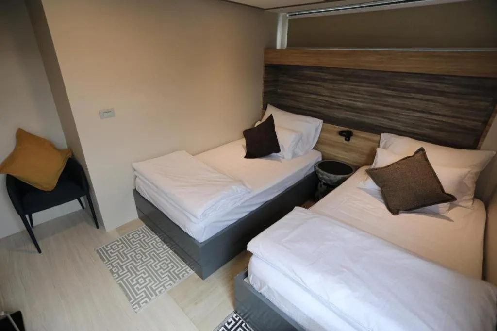 Bed in The River House Chiangkhan Hotel