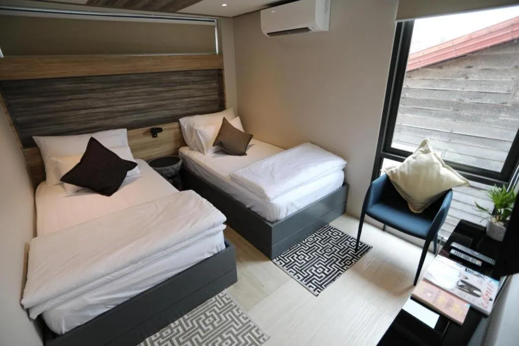 Bed in The River House Chiangkhan Hotel