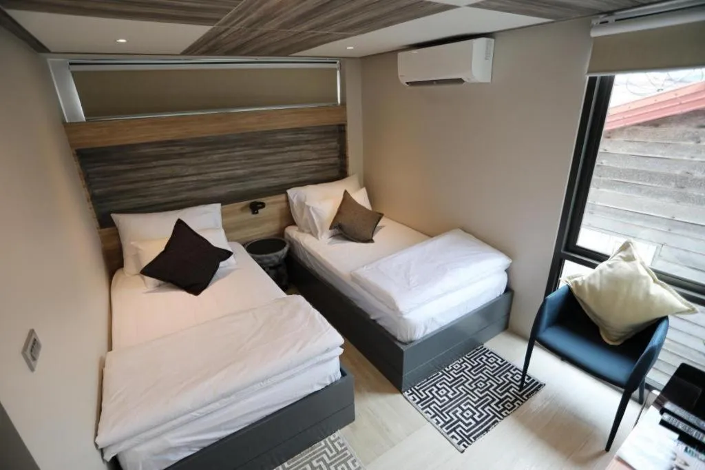 Bed in The River House Chiangkhan Hotel