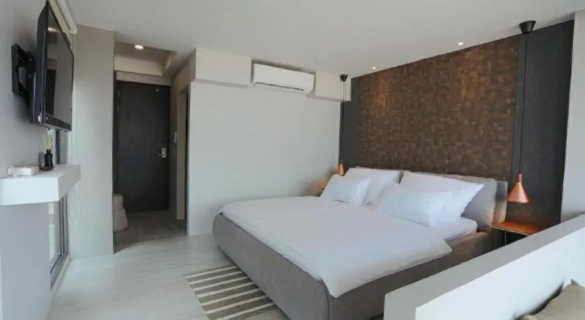 Bed in The River House Chiangkhan Hotel