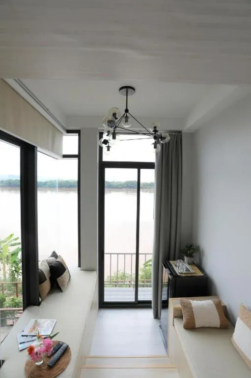 Bed in The River House Chiangkhan Hotel