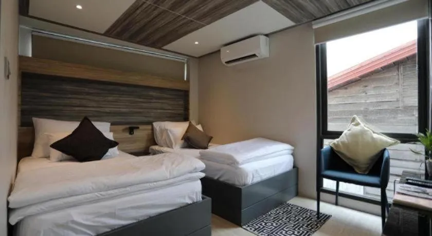 Bed in The River House Chiangkhan Hotel