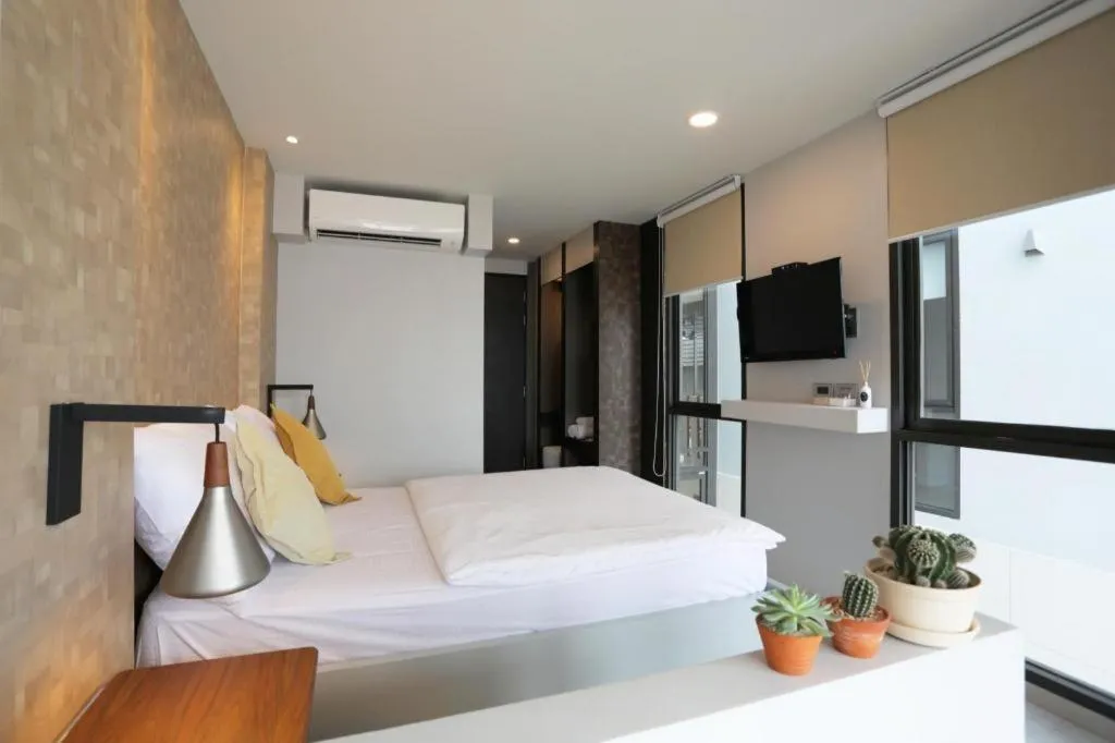 Bed in The River House Chiangkhan Hotel