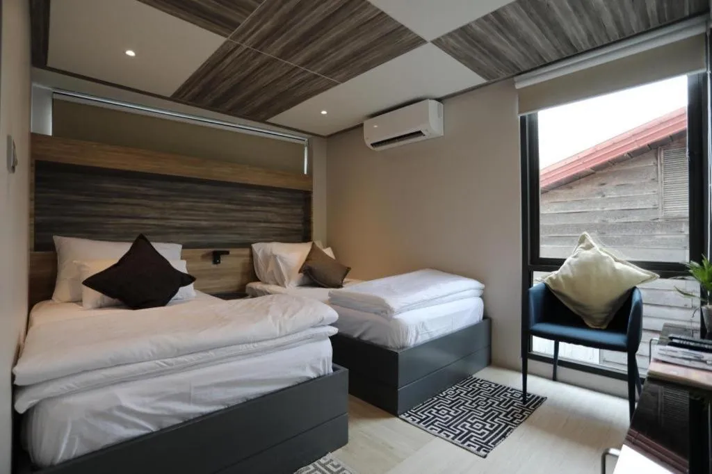 Bed in The River House Chiangkhan Hotel