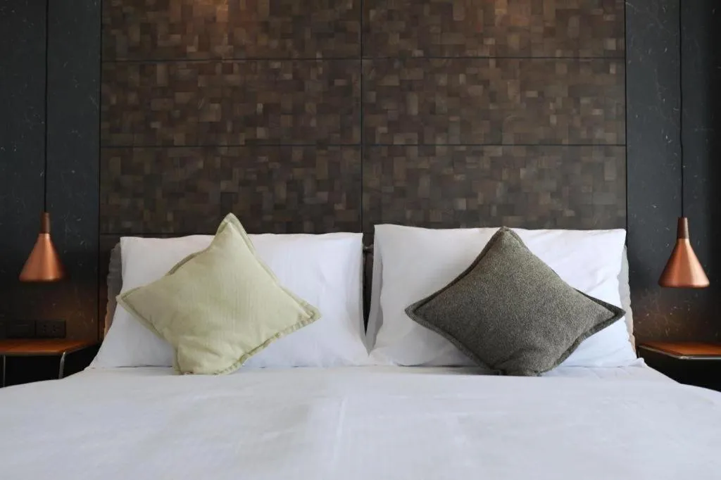 Bed in The River House Chiangkhan Hotel