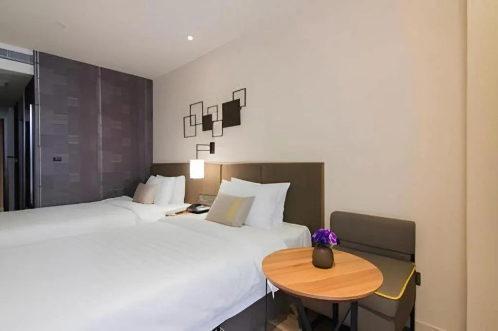 Bed in Home Inn Plus Shanghai Pudong Xinjinqiao Road