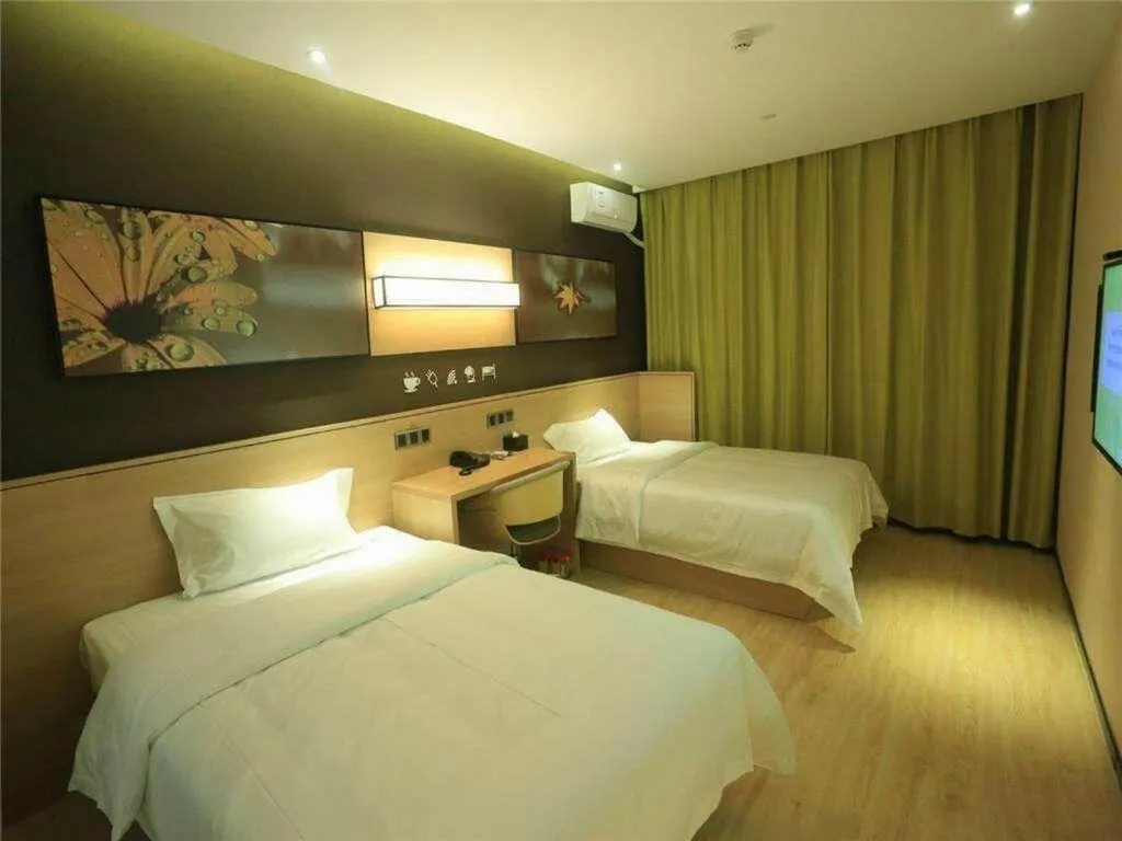 Bed in IU Hotels Xinzhou Bus Terminal
