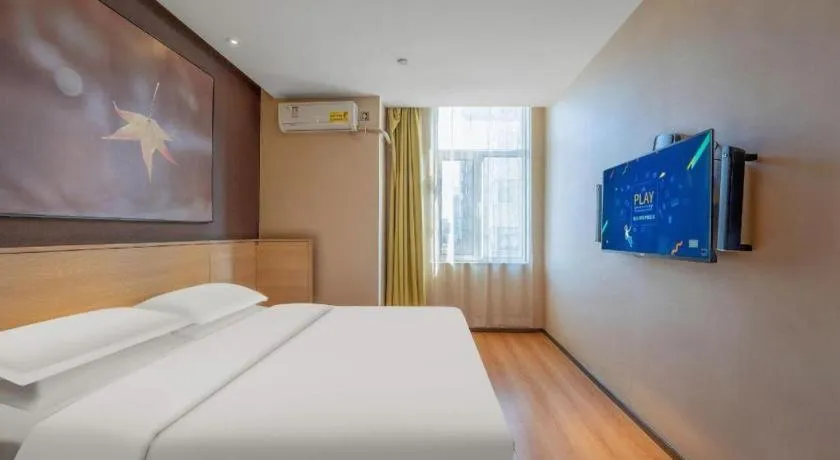 Bed in IU Hotels Xinzhou Bus Terminal