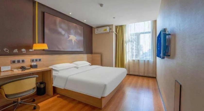 Bed in IU Hotels Xinzhou Bus Terminal