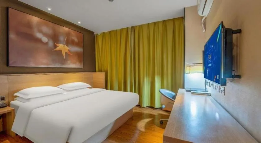 Bed in IU Hotels Xinzhou Bus Terminal