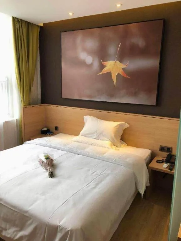 Bed in IU Hotels Xinzhou Bus Terminal