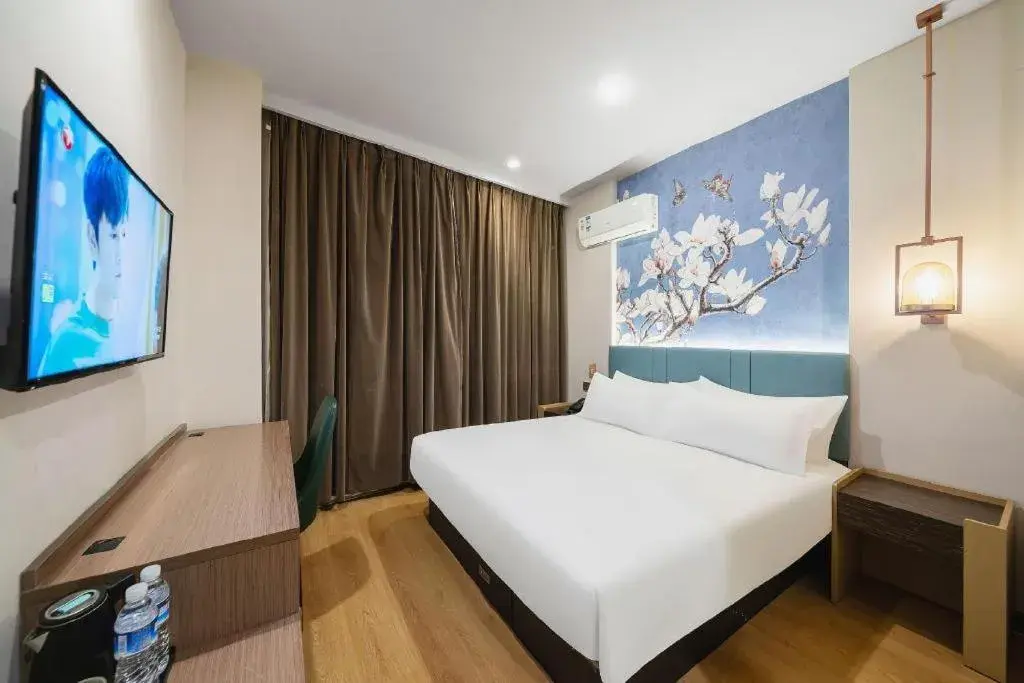 Bed in Magnotel Hotel Shanghai Railway Station Magnolia Plaza Bed in Magnotel Hotel Shanghai Railway Station Magnolia Plaza