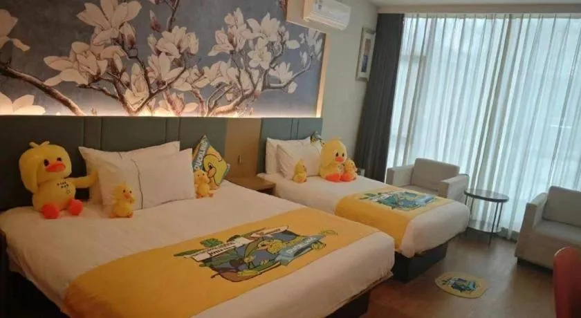 Bed in Magnotel Hotel Shanghai Railway Station Magnolia Plaza