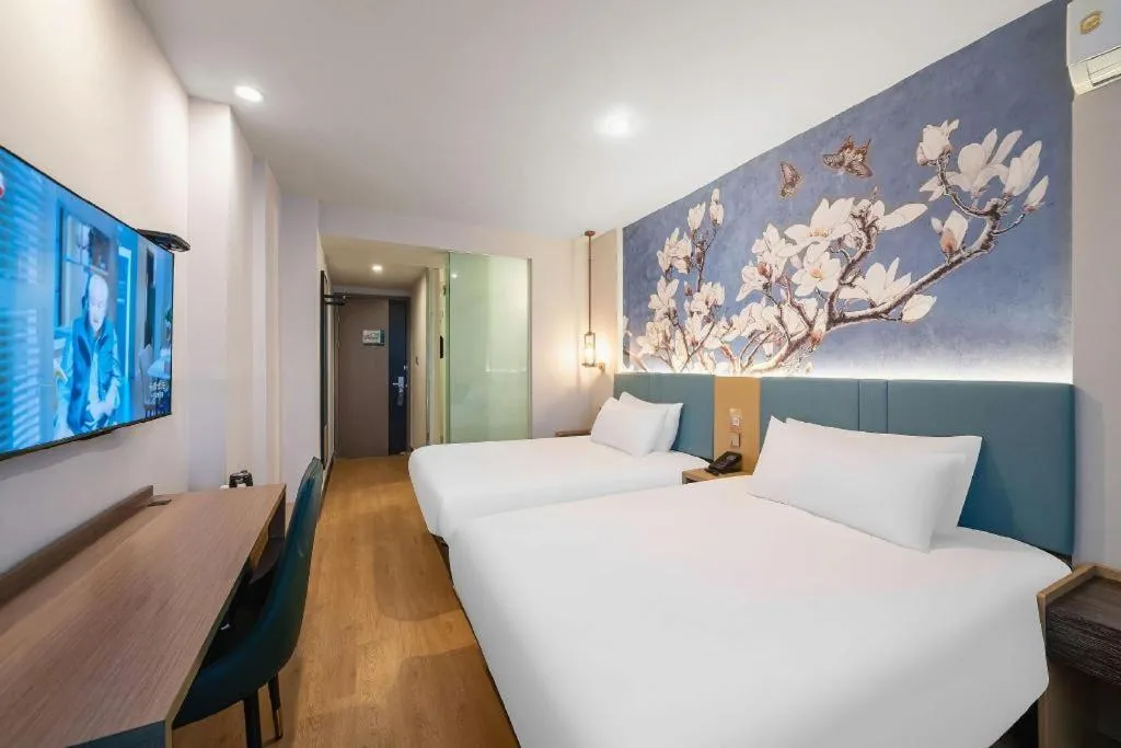 Bed in Magnotel Hotel Shanghai Railway Station Magnolia Plaza