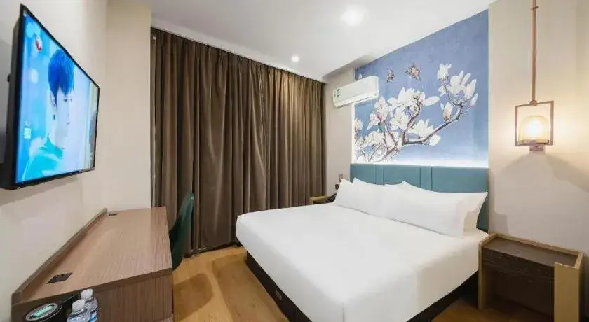 Bed in Magnotel Hotel Shanghai Railway Station Magnolia Plaza Bed in Magnotel Hotel Shanghai Railway Station Magnolia Plaza