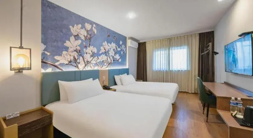 Bed in Magnotel Hotel Shanghai Railway Station Magnolia Plaza Bed in Magnotel Hotel Shanghai Railway Station Magnolia Plaza