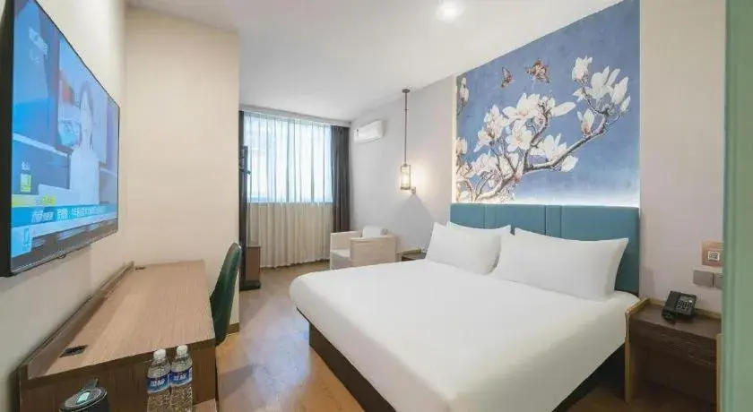 Bed in Magnotel Hotel Shanghai Railway Station Magnolia Plaza Bed in Magnotel Hotel Shanghai Railway Station Magnolia Plaza