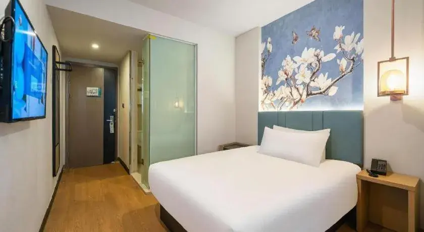 Bed in Magnotel Hotel Shanghai Railway Station Magnolia Plaza Bed in Magnotel Hotel Shanghai Railway Station Magnolia Plaza