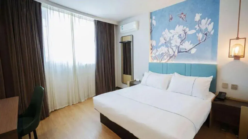 Bed in Magnotel Hotel Shanghai Railway Station Magnolia Plaza Bed in Magnotel Hotel Shanghai Railway Station Magnolia Plaza