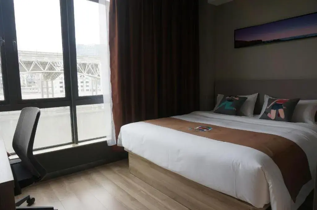 Bed in Pai Hotel Zhenjiang Railway Station South Square Bed in Pai Hotel Zhenjiang Railway Station South Square