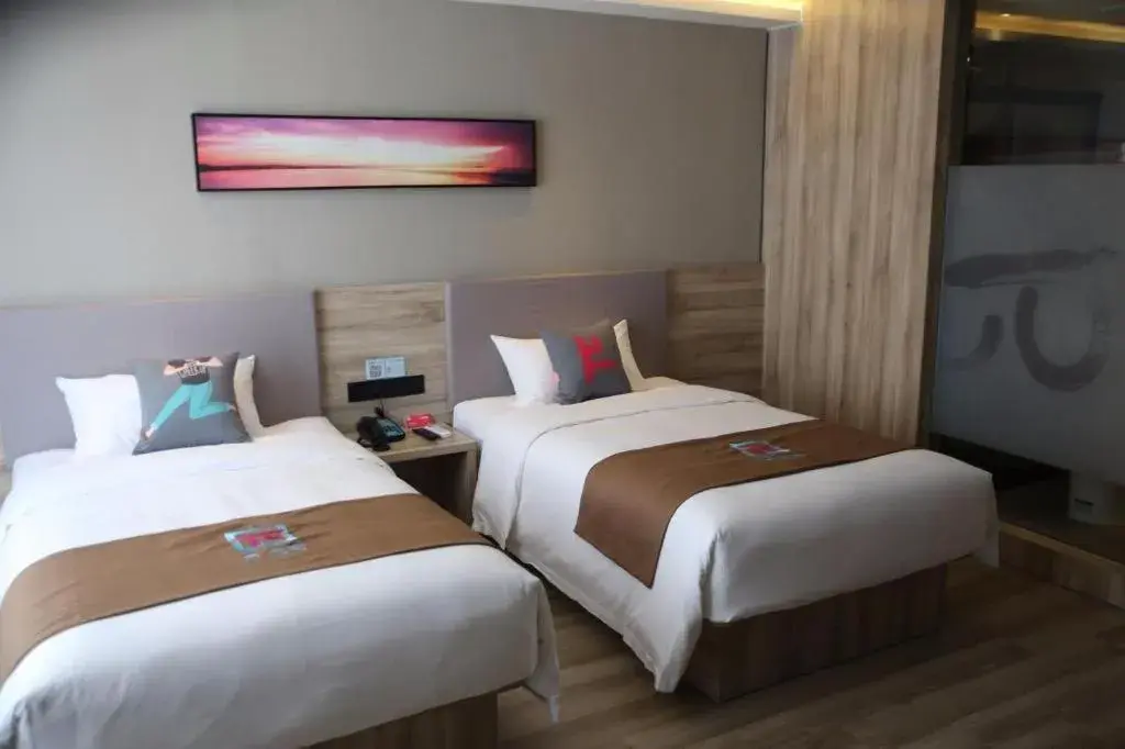 Bed in Pai Hotel Zhenjiang Railway Station South Square Bed in Pai Hotel Zhenjiang Railway Station South Square