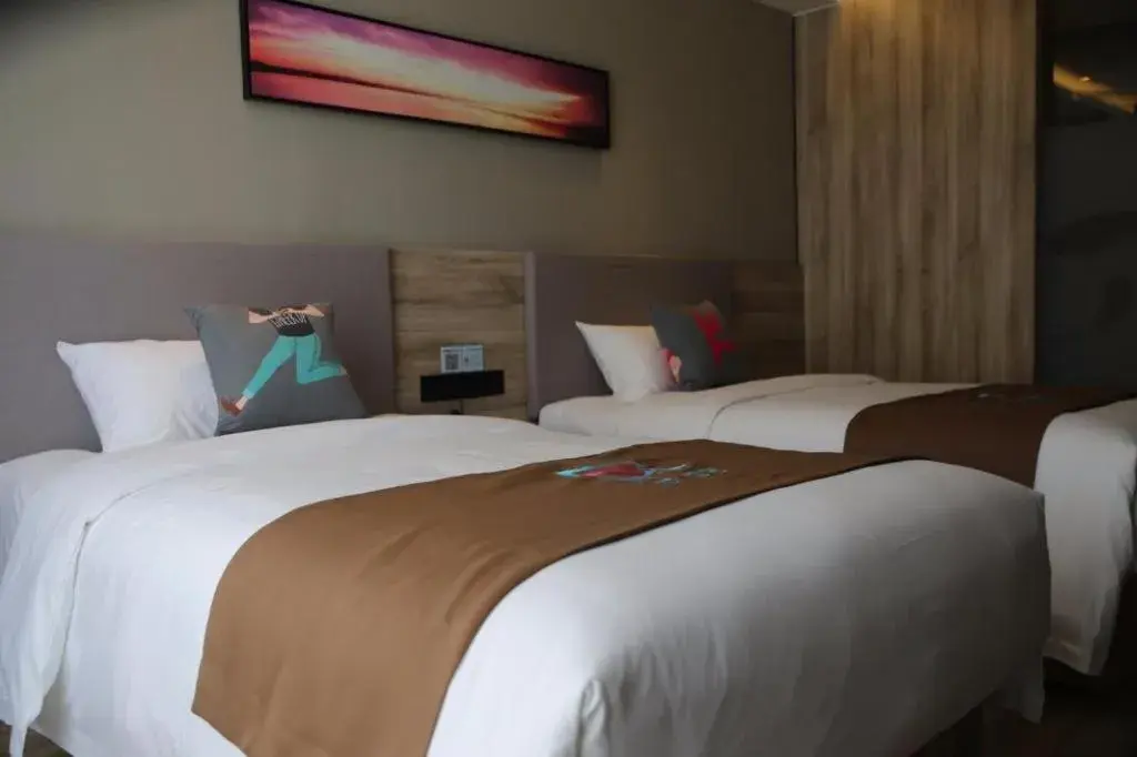 Bed in Pai Hotel Zhenjiang Railway Station South Square Bed in Pai Hotel Zhenjiang Railway Station South Square