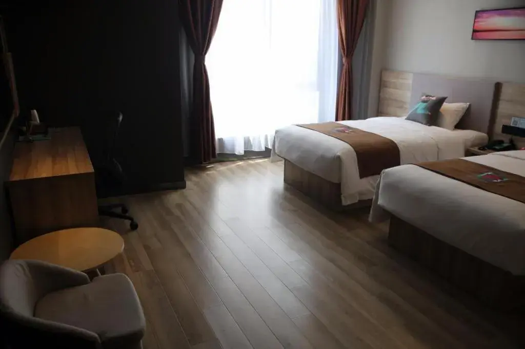 Bed in Pai Hotel Zhenjiang Railway Station South Square Bed in Pai Hotel Zhenjiang Railway Station South Square