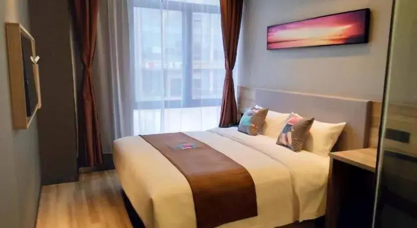 Bed in Pai Hotel Zhenjiang Railway Station South Square Bed in Pai Hotel Zhenjiang Railway Station South Square