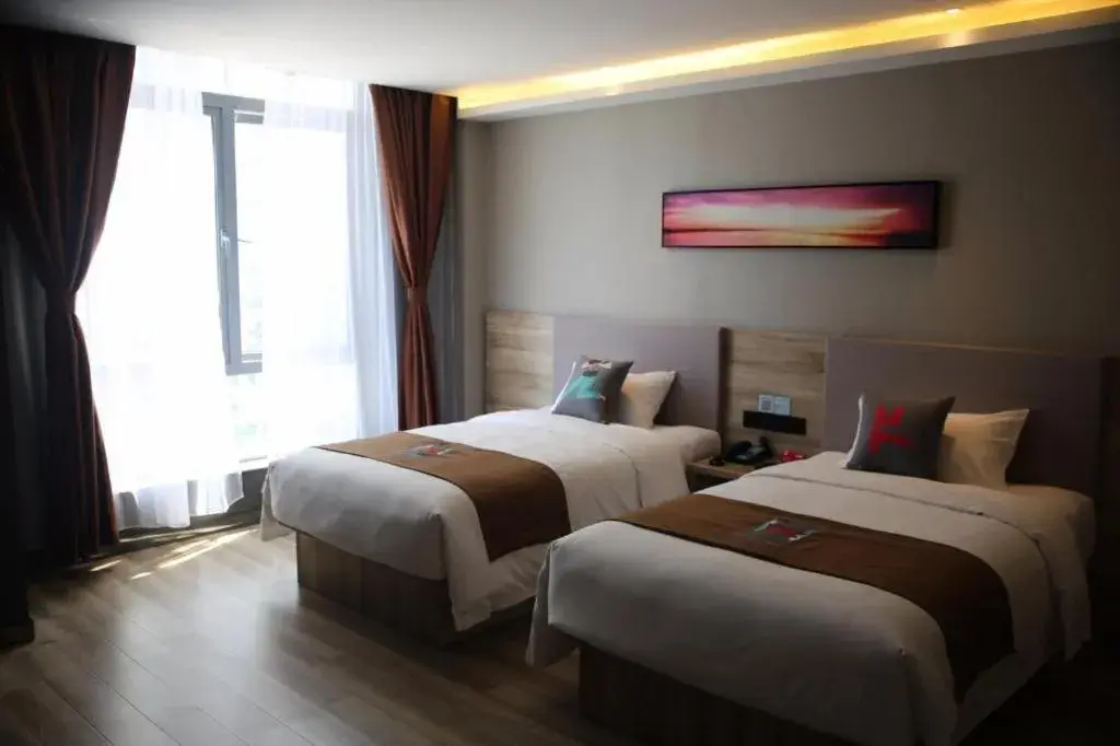 Bed in Pai Hotel Zhenjiang Railway Station South Square Bed in Pai Hotel Zhenjiang Railway Station South Square