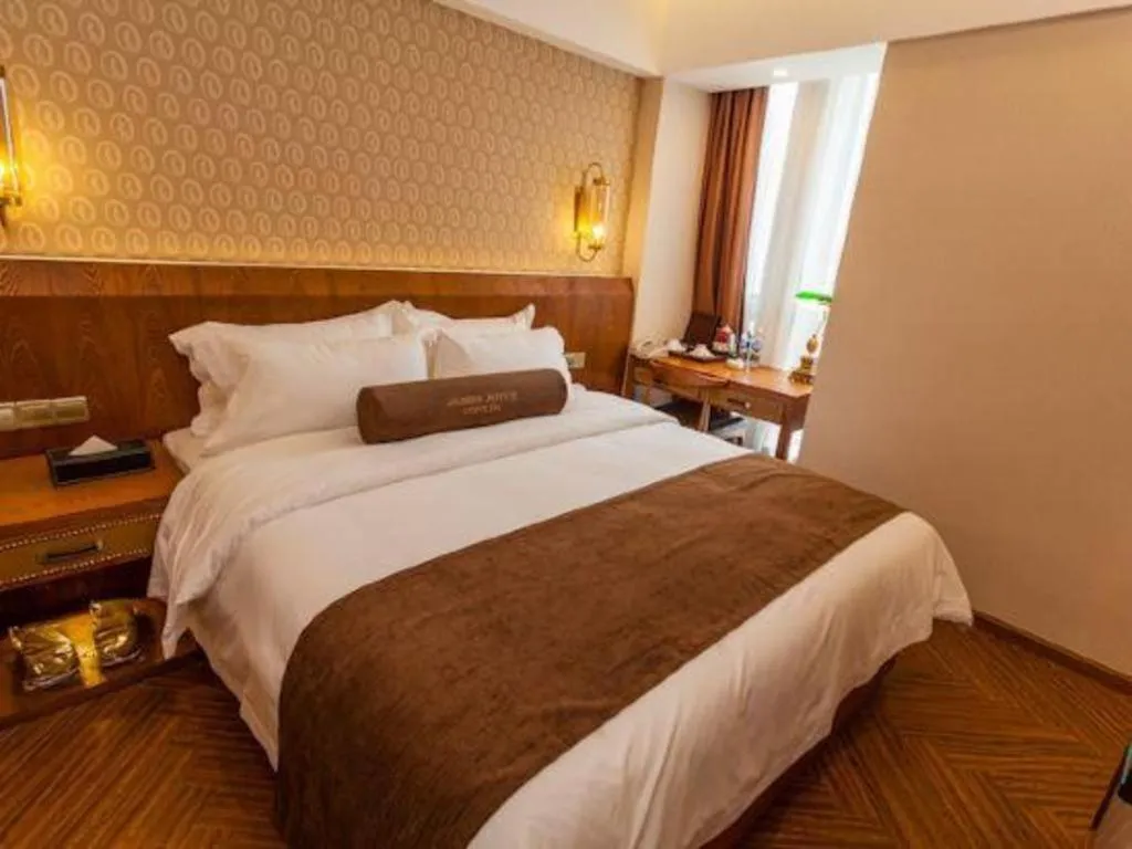 Bed in James Joyce Coffetel Chengdu Century City Convention and Exhibition Center