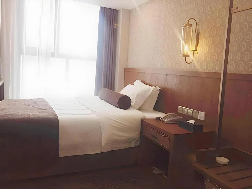 Bed in James Joyce Coffetel Chengdu Century City Convention and Exhibition Center