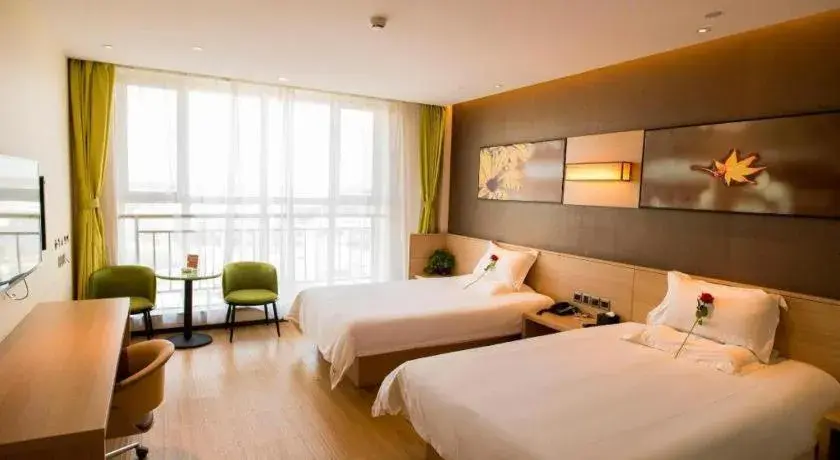 Bed in IU Hotel Zhangye High-Speed Railway Station Bed in IU Hotel Zhangye High-Speed Railway Station