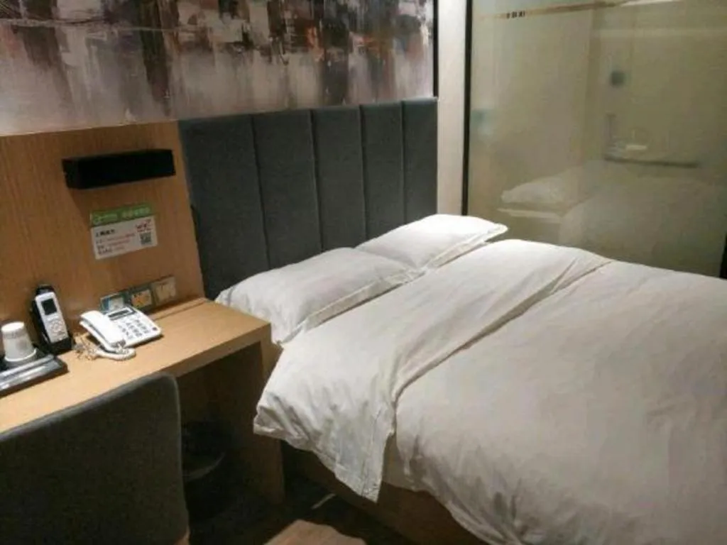 Bed in Yimi Hotel Guangzhou Sport College Branch