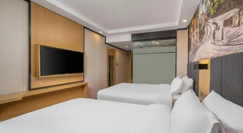 Bed in Yimi Hotel Guangzhou Sport College Branch