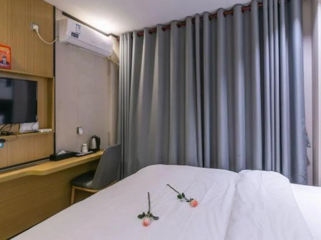 Bed in Yimi Hotel Guangzhou Sport College Branch