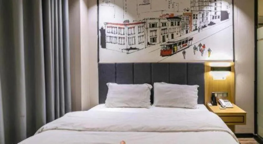 Bed in Yimi Hotel Guangzhou Sport College Branch