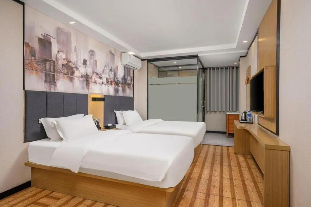 Bed in Yimi Hotel Guangzhou Sport College Branch