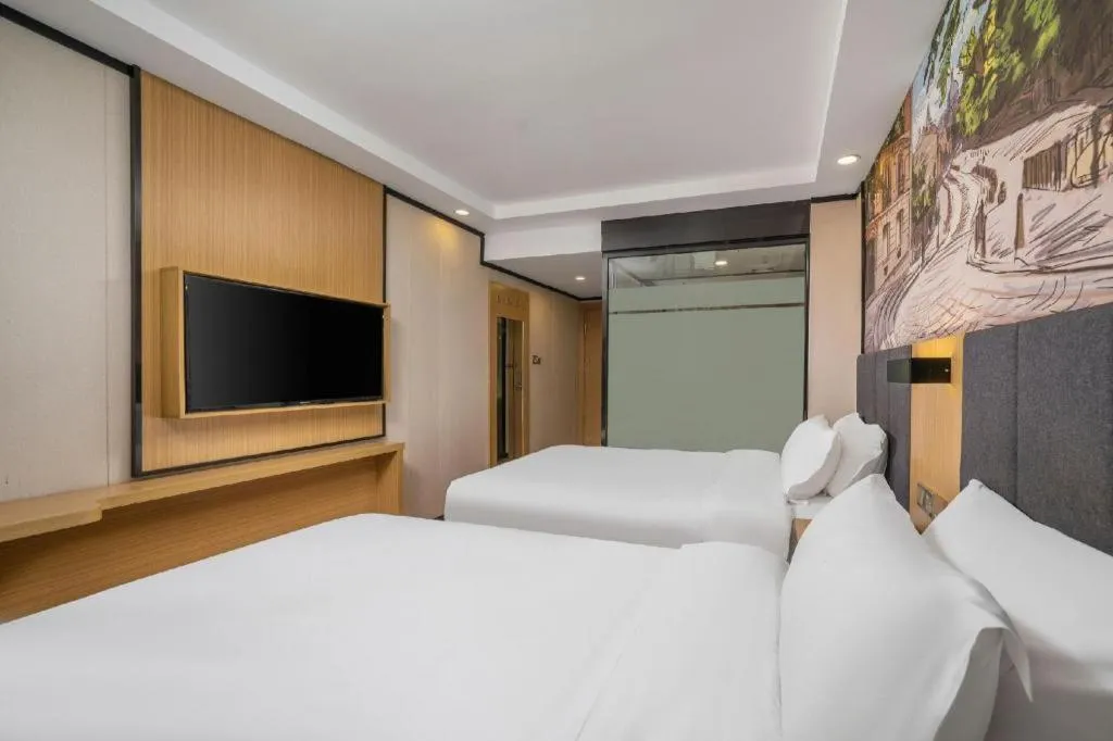 Bed in Yimi Hotel Guangzhou Sport College Branch