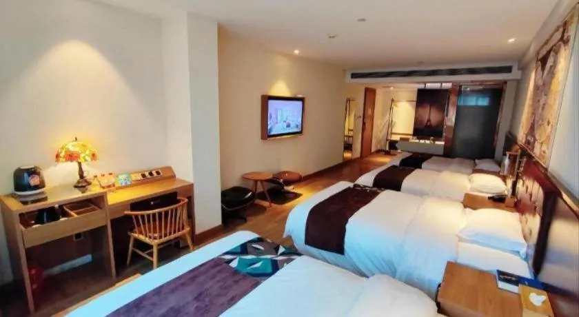 Bed in James Joyce Coffetel Zhengzhou CBD Exhibition Center Provincial People's Hospital