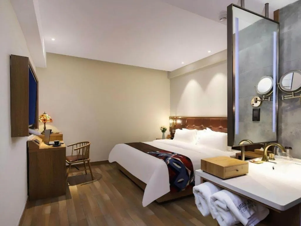 Bed in James Joyce Coffetel Zhengzhou CBD Exhibition Center Provincial People's Hospital