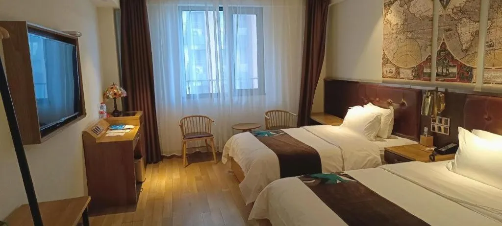 Bed in James Joyce Coffetel Zhengzhou CBD Exhibition Center Provincial People's Hospital