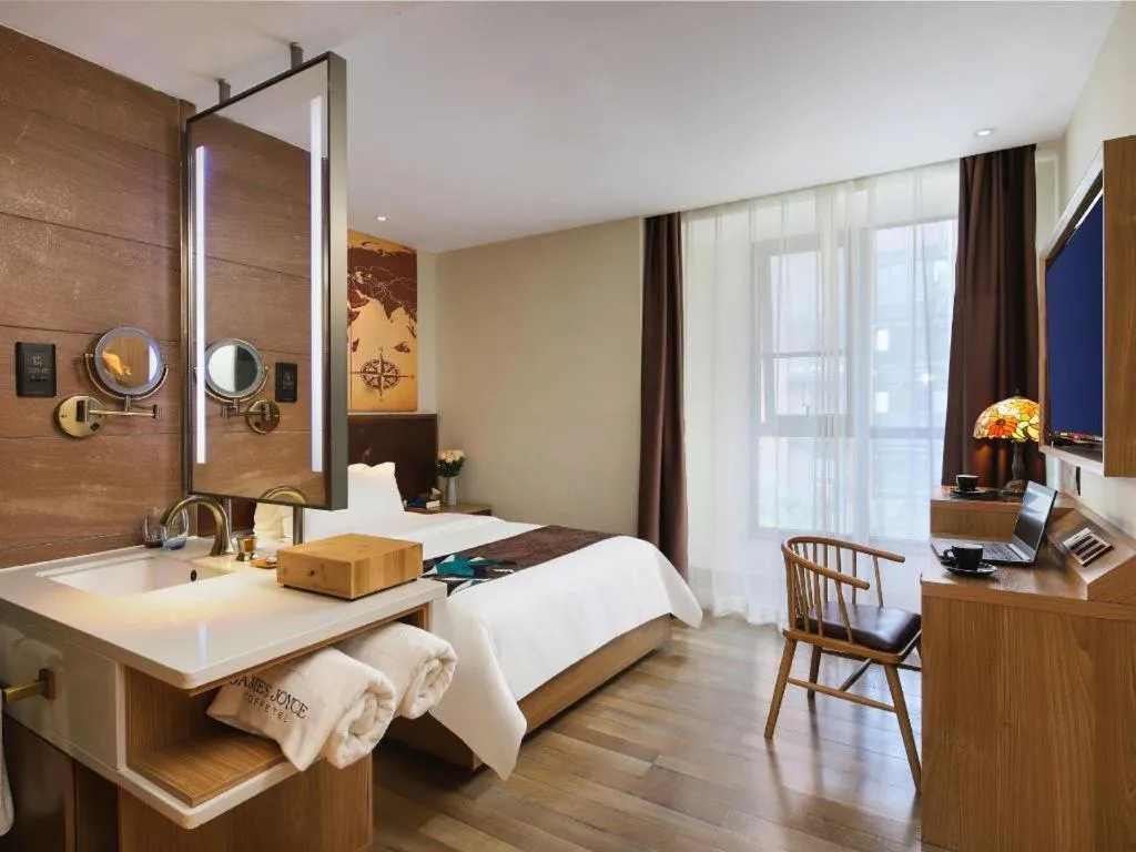 Bed in James Joyce Coffetel Zhengzhou CBD Exhibition Center Provincial People's Hospital