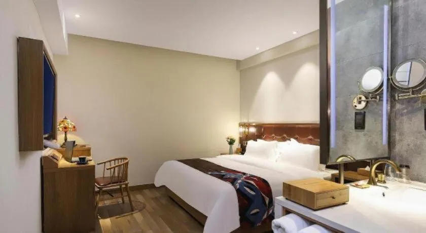 Bed in James Joyce Coffetel Zhengzhou CBD Exhibition Center Provincial People's Hospital