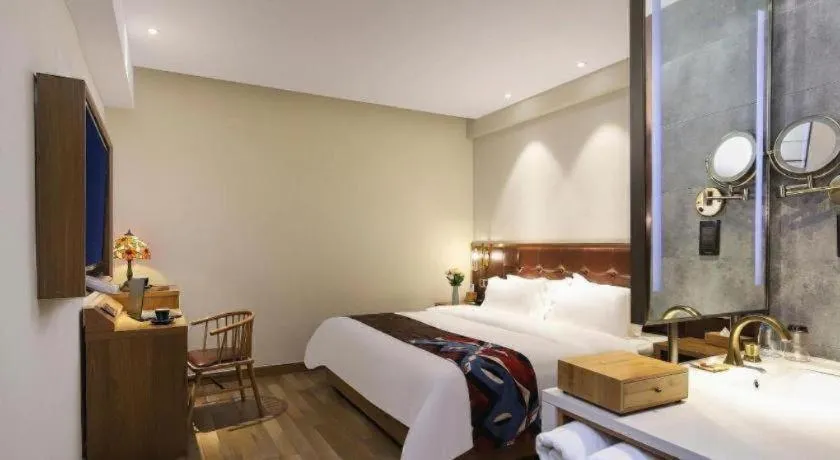 Bed in James Joyce Coffetel Zhengzhou CBD Exhibition Center Provincial People's Hospital