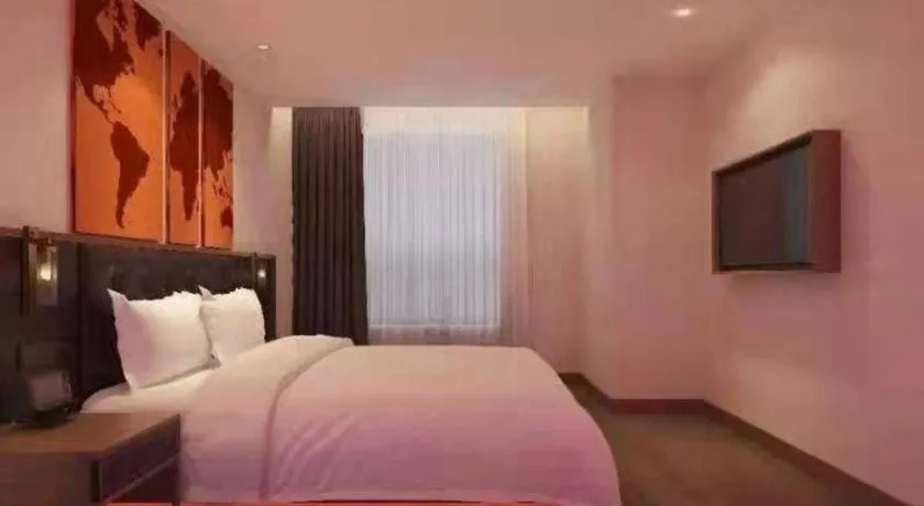 Bed in James Joyce Coffetel Zhengzhou CBD Exhibition Center Provincial People's Hospital