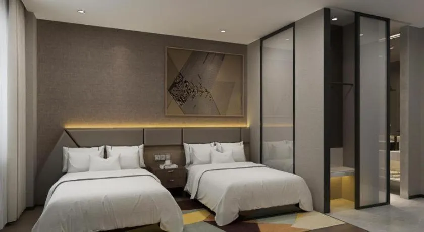 Bed in IU Hotel Qingdao Golden Beach Xuejiadao Metro Station